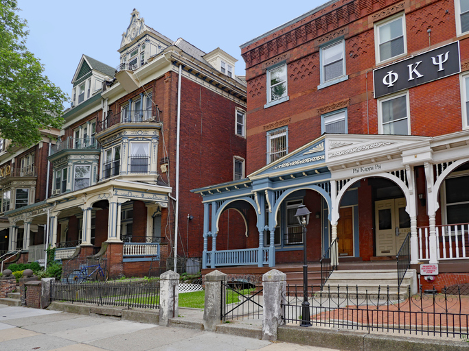 Philadelphia, USA - May 28, 2019: The residential area around the University of Pennsylvania, has many large old houses with large porches used as fraternity and sorority houses.